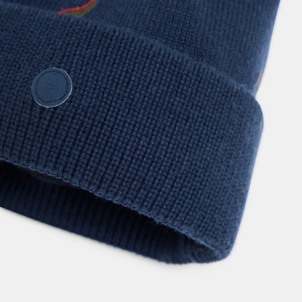 قبعة من التريكو مطرزة برسمة ديناصور باللون الأزرق البحري للأولاد.